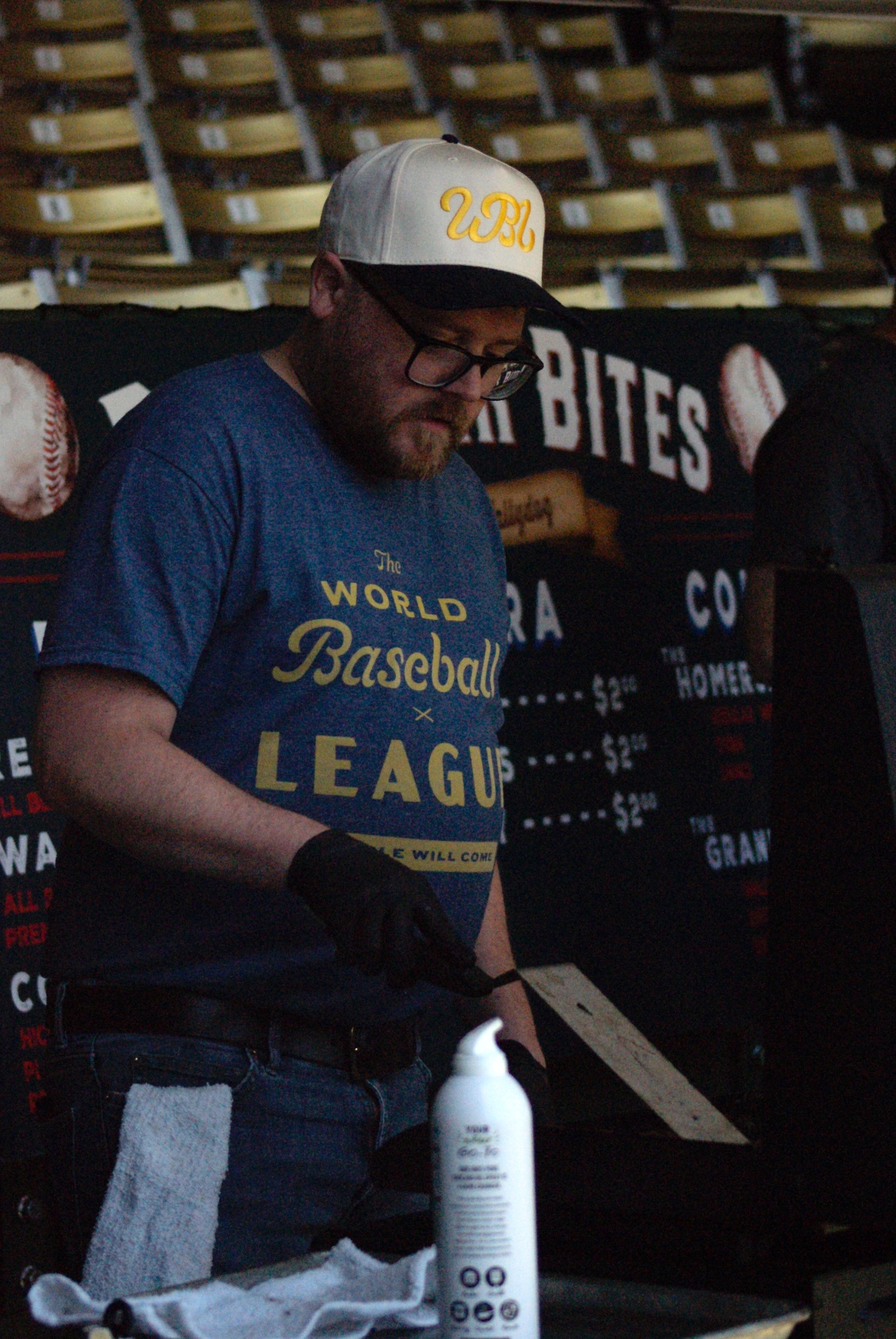 The World Baseball League’s chef, Chef Wally, prepares his world-famous hot dogs.