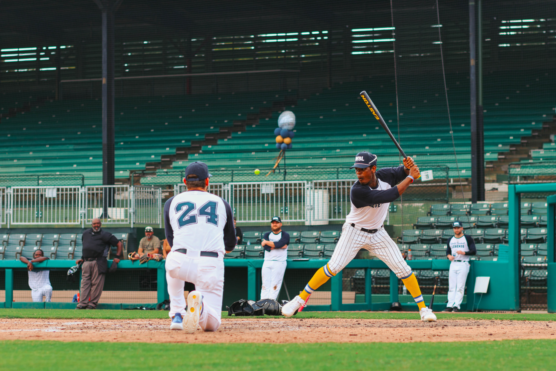 Former Big Leaguer TJ Dix takes a swing at a golf ball during the WBL Long Drive Challenge.